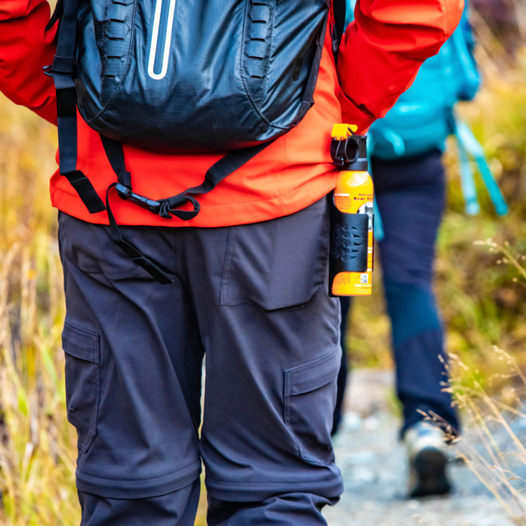 Man carrying bear spray on his hip. 