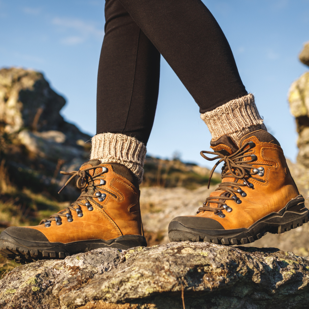 Hiker wearing boots. An example of safety wear that helps protect against snakes and other smaller wildlife